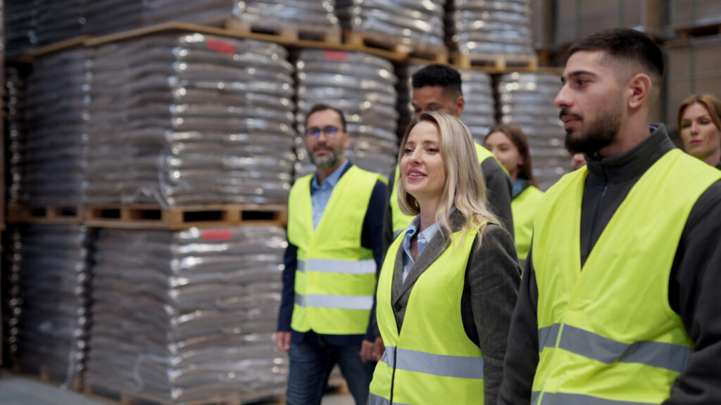 team of employees walking in a warehouse